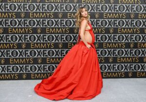 At the 2023 Emmy Awards, Suki Waterhouse, who is expecting, claims that the red Valentino gown she wore had to "fit the bump."